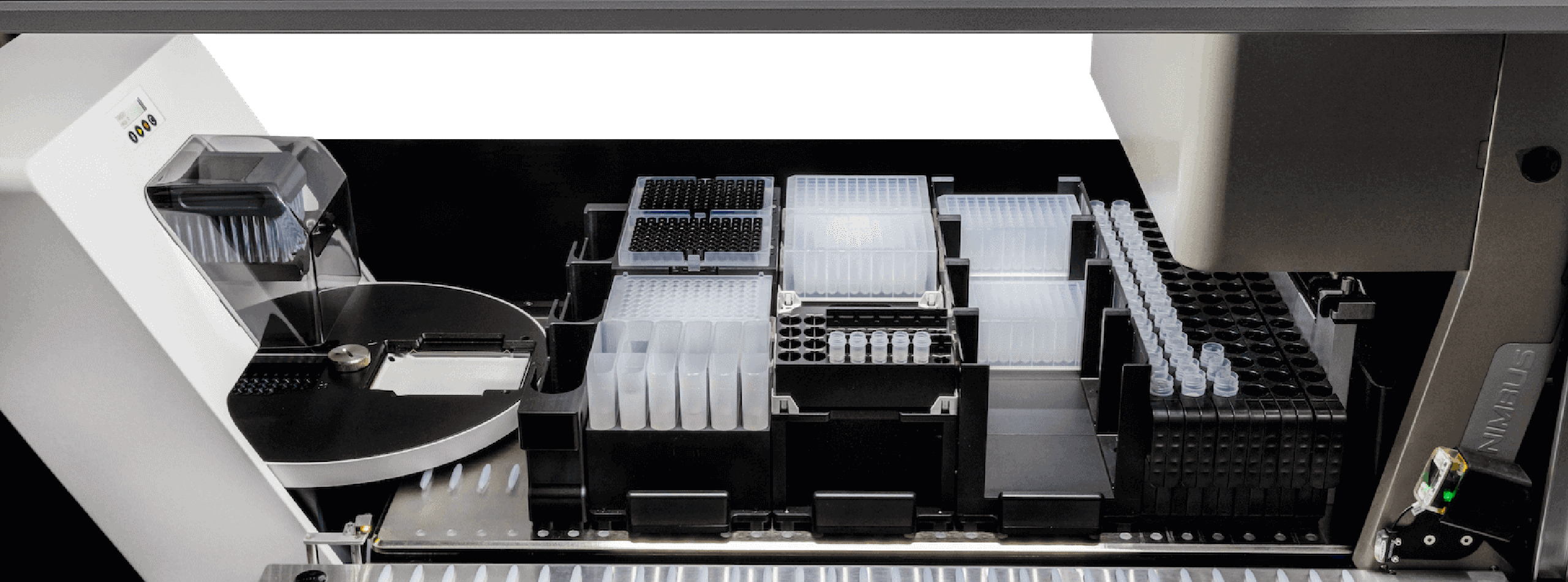 A machine displaying a tray filled with various plastic containers
