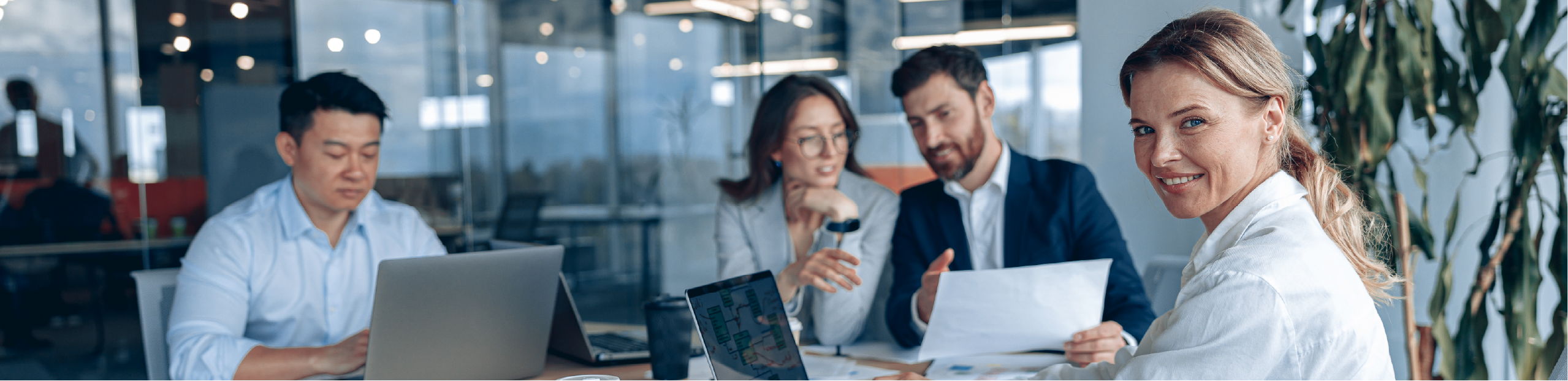 a group of people in an office environment discussing