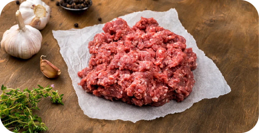 ground beef arranged in a hamburger patty on paper towel