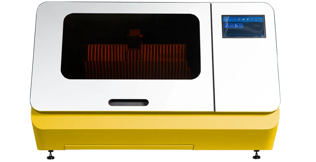 A RIDA®Xtract 24 instrument. Large, rectangular piece of equipment with a white facade, yellow base and two dark glass screens