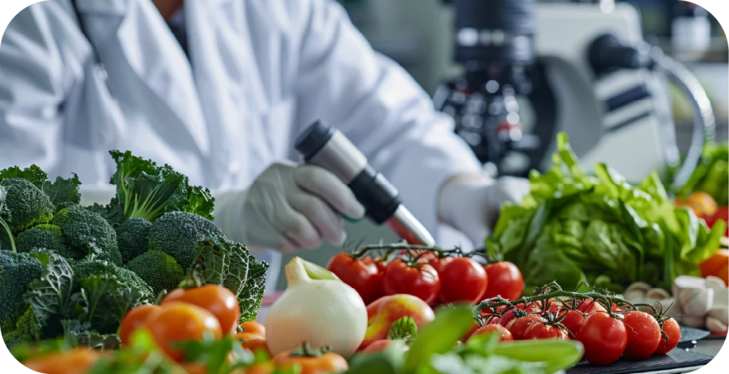 a scientist in a lab coat conducts testing on fresh produce