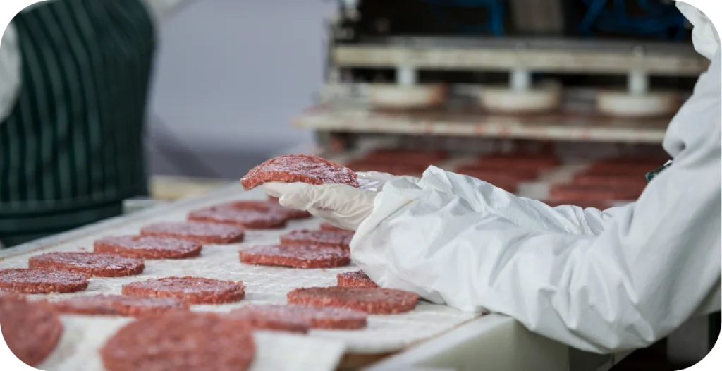 a person forms ground beef into hamburger patties after indicator organism testing has been conducted