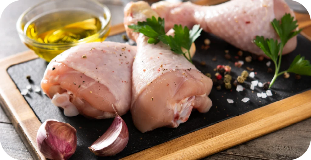 raw chicken with olive oil and herbs placed on a chopping board after pathogenic bacteria testing
