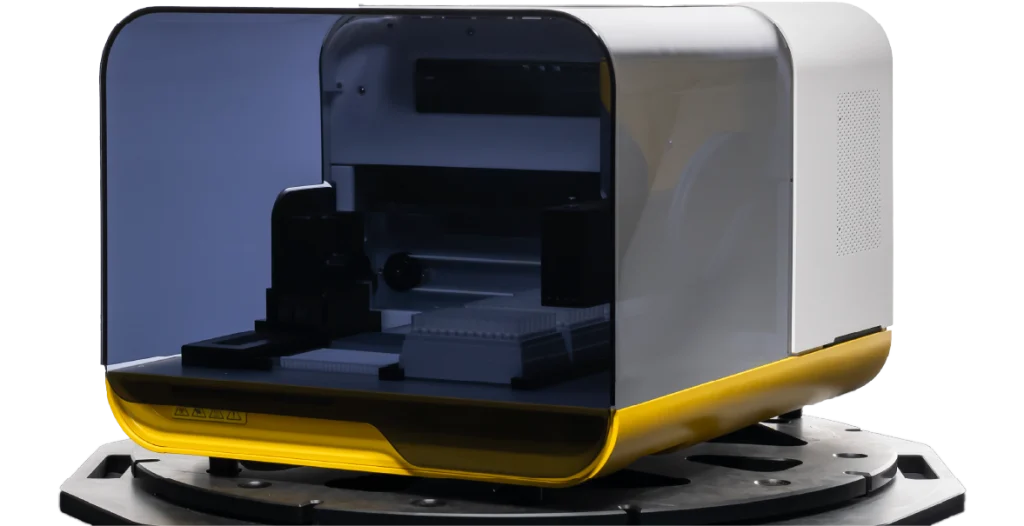 a RIDA®Xplore sits on a plate on an angle. It is predominantly dark glass at the front with a white back and yellow base