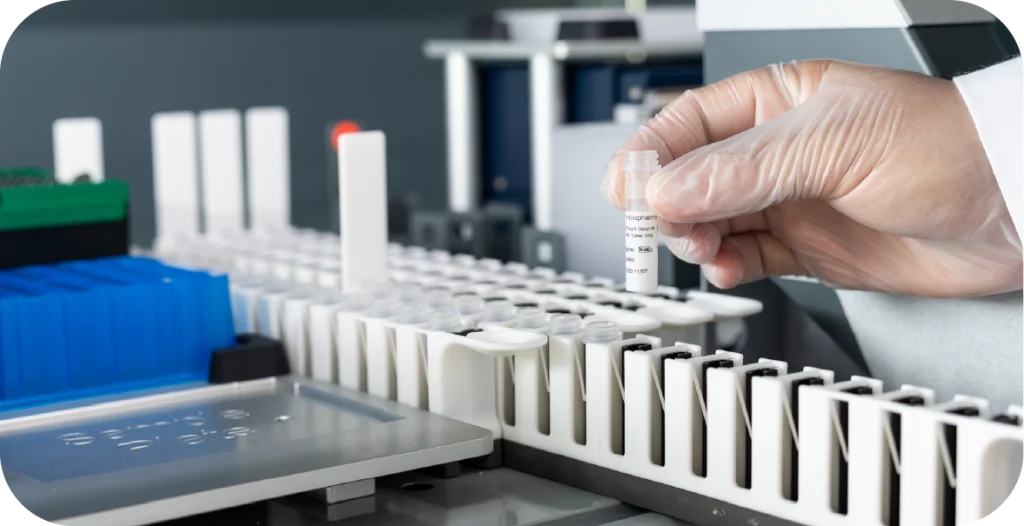 A man in a lab coat and gloves conducts a RIDA®Xtract 96 DNA/RNA Test Kit procedure