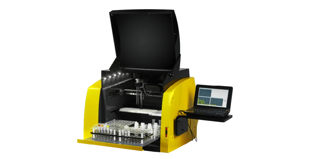 a complex piece of food and feed analysis technology with yellow sides, a black interior and a computer sitting to the right-hand side