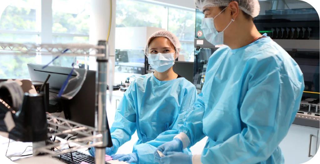 two scientists in a lab conducting women's health diagnostics testing