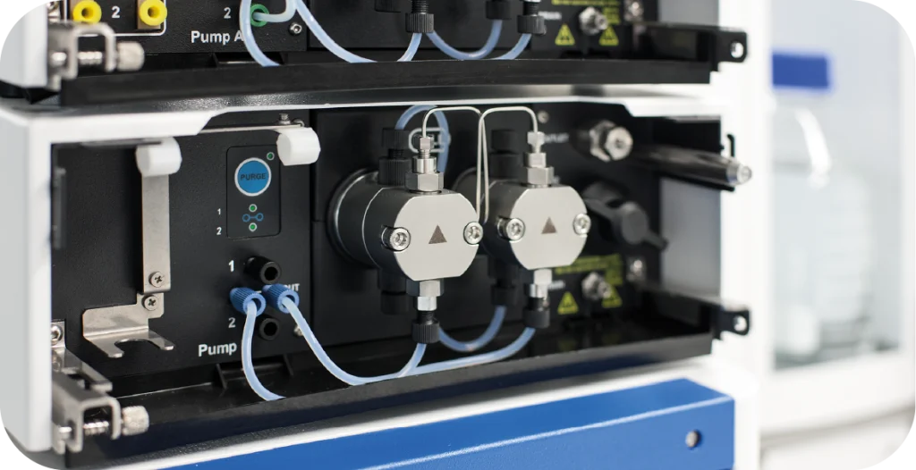 The internal workings of a complex diagnostic machine, including pipes, gauges, knobs and buttons