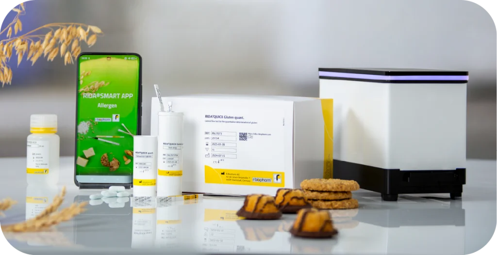 a phone with the RIDA®SMART APP Allergen next to a RIDA®SMART APP BOX, diagnostic tests and food